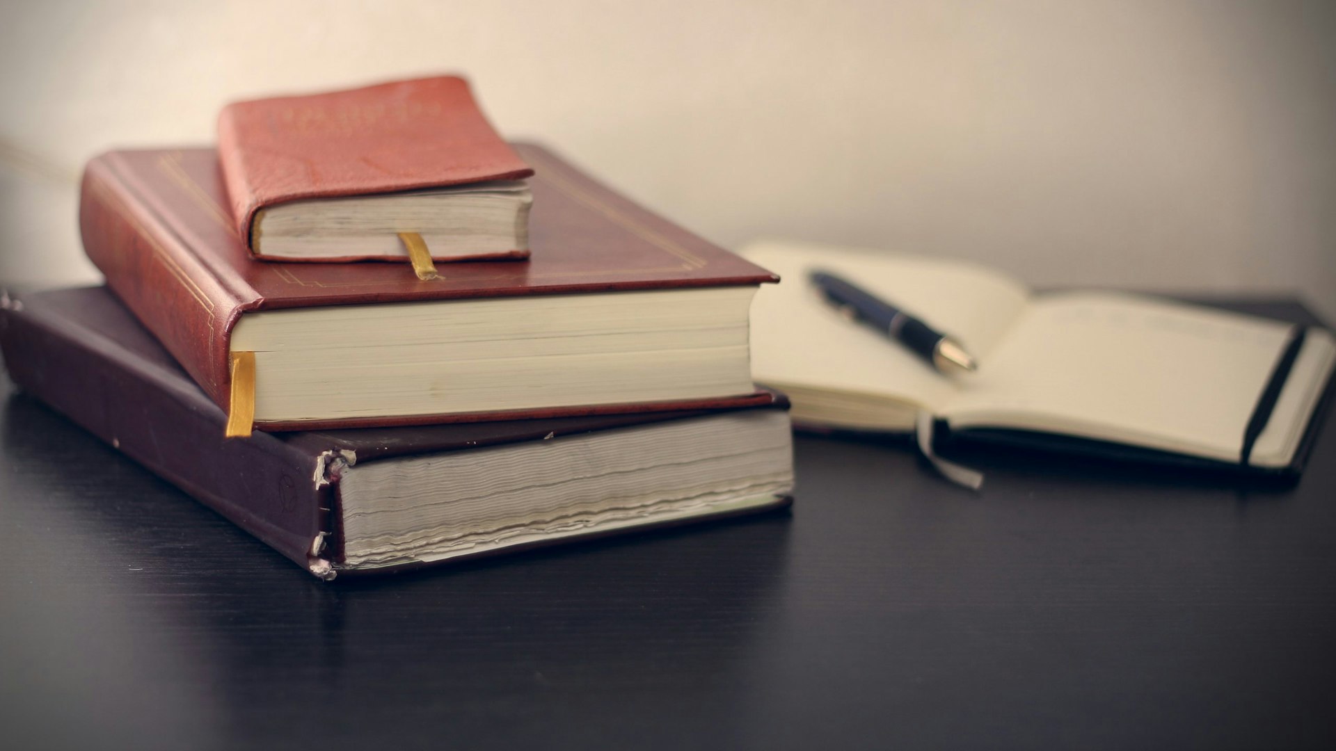 Law books and a pen on a desk